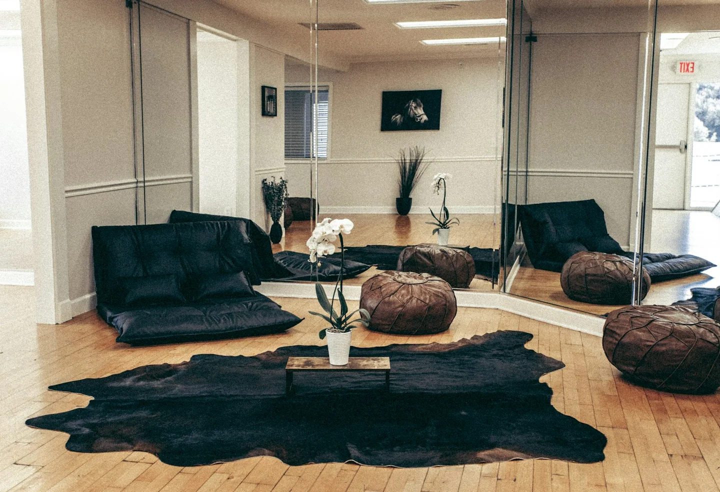 Massage studio sitting area with open floor space