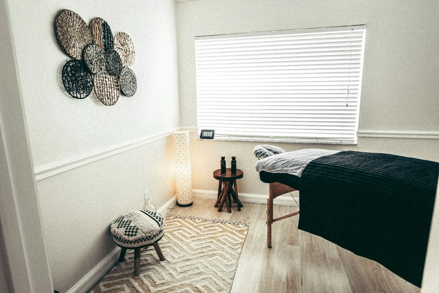 Prepared massage table in a compact treatment room