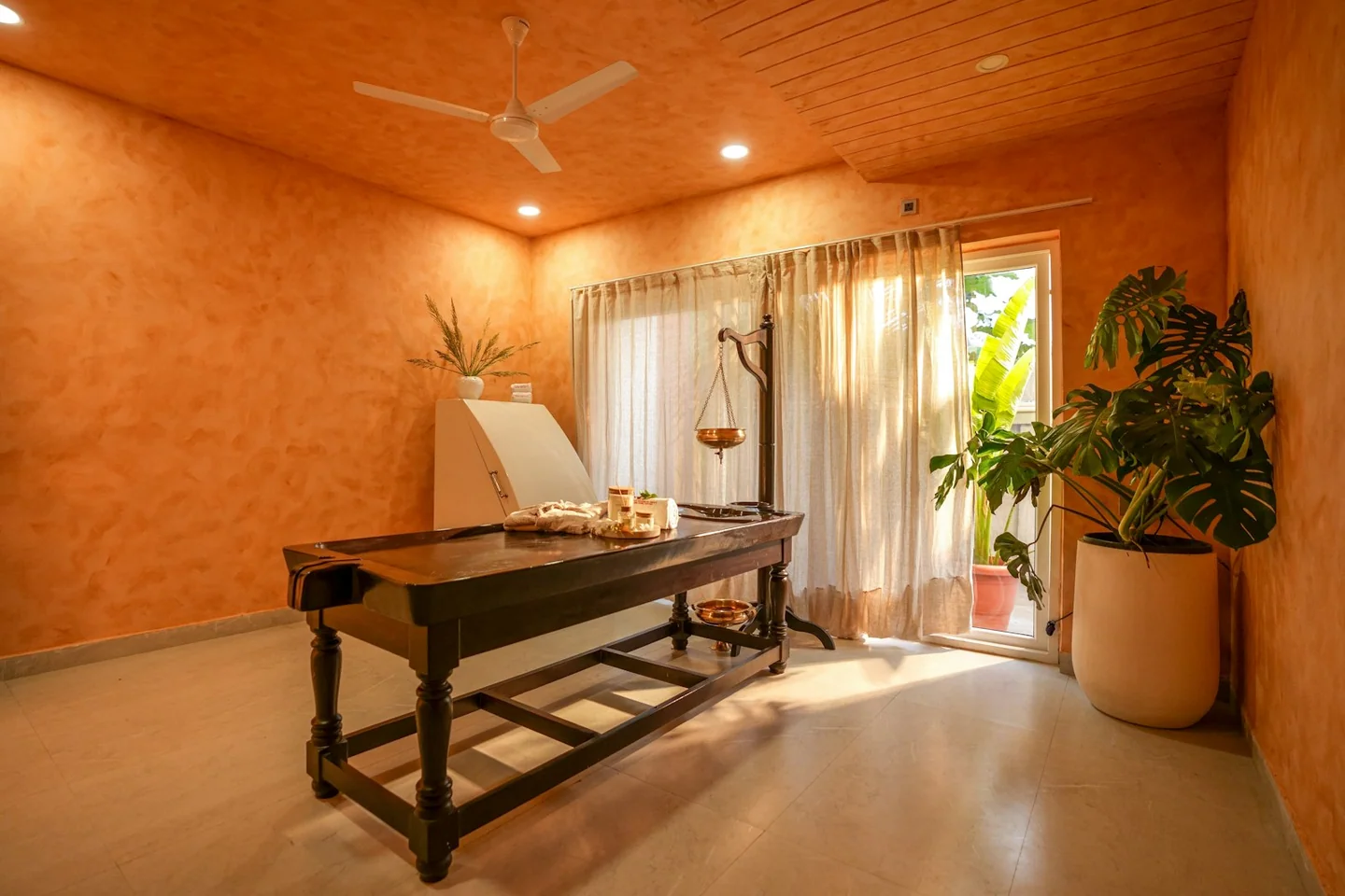 Prepared massage room with a treatment table